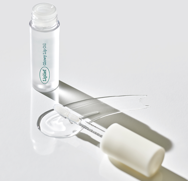 Vegan lip oil with clear glossy finish and eco-friendly packaging